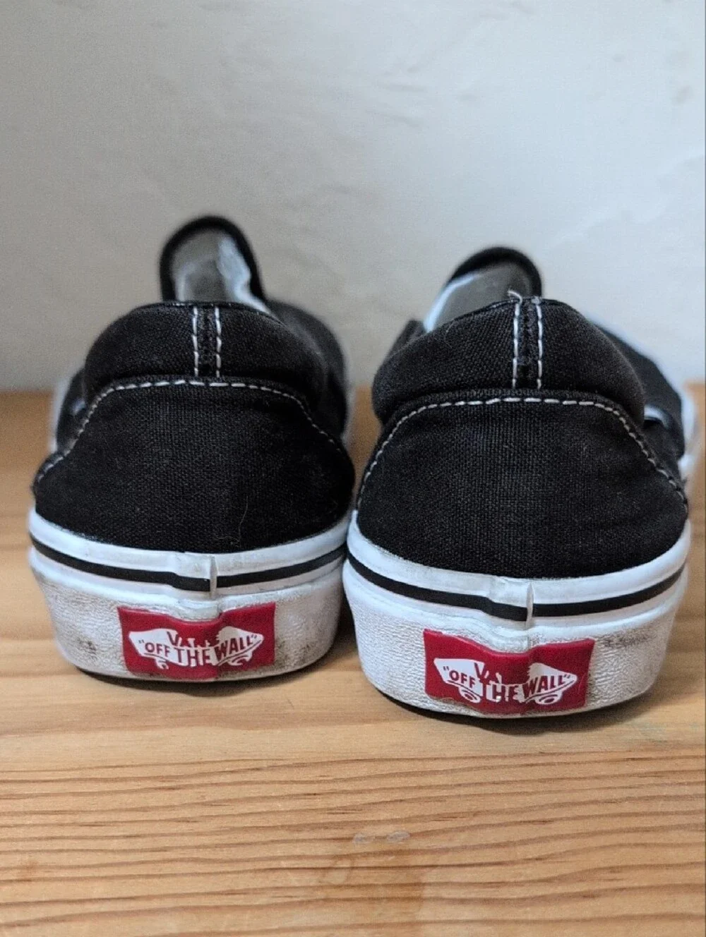 Vans Kids Slip-On Canvas Sneakers - Black & White 3.5 M/5 W (Big Kid)